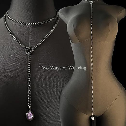 Two-way Cuban chain necklace with openable heart O-ring and purple oval gemstone pendant on black mannequin